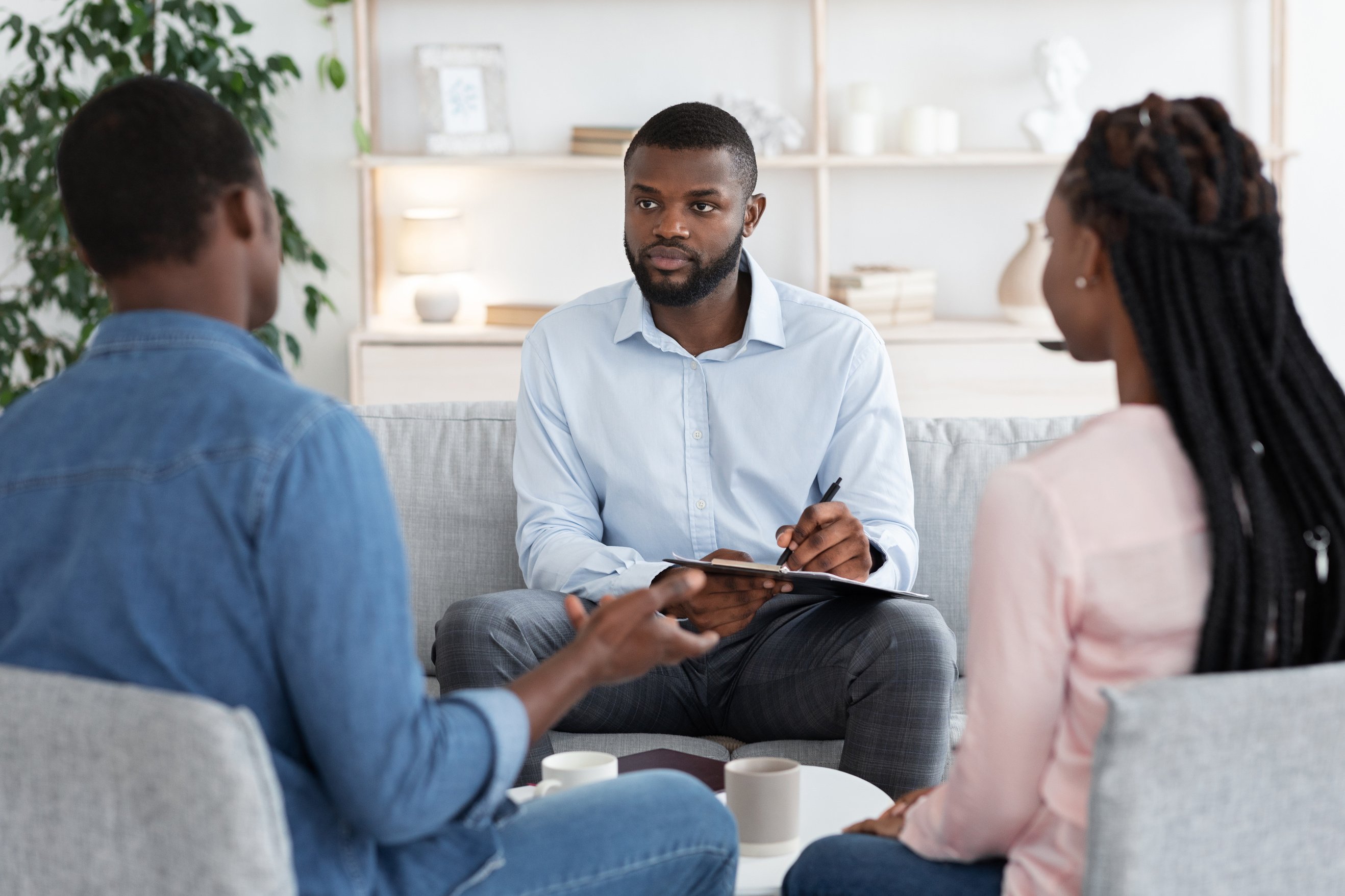 Professional Marital Therapist Having Session With Young Black Spouses, Selective Focus